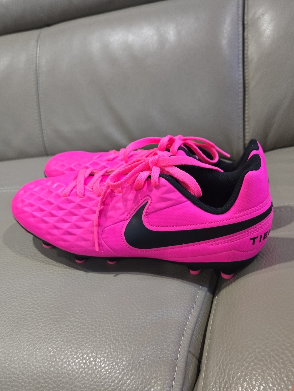 Nike Kids Pink Soccer Cleats with Black Swoosh